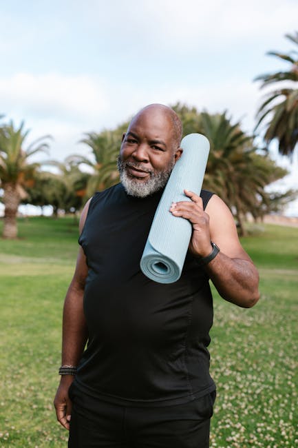 Person looking out a window while holding a yoga mat, ready for practice